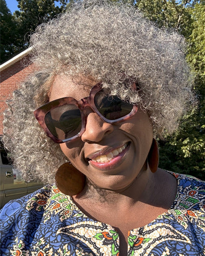 Soul Lady Wigs| Short jerry curly gray human hair wig from Soul Lady Wigs, showing soft curls and a natural salt and pepper shine.