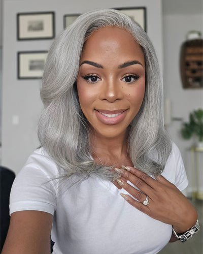 Soul Lady Light Salt and Pepper Body Wave Human Hair 5x5 HD Lace Wig. The soft body wave texture flows gracefully, blending light gray and black tones for a natural salt and pepper look. 