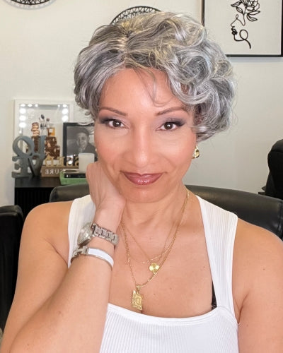 Soul Lady standard salt and pepper natural wave pixie cut wig shows the soft natural waves and blended gray and black tones of the short pixie style. The wig looks realistic, lightweight, and stylish, framing her face beautifully.