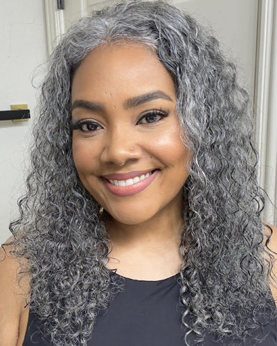 The soft water wave curls flow naturally, showing a beautiful mix of gray and silver tones. The lace front creates a realistic hairline, giving the wig a natural and elegant appearance.