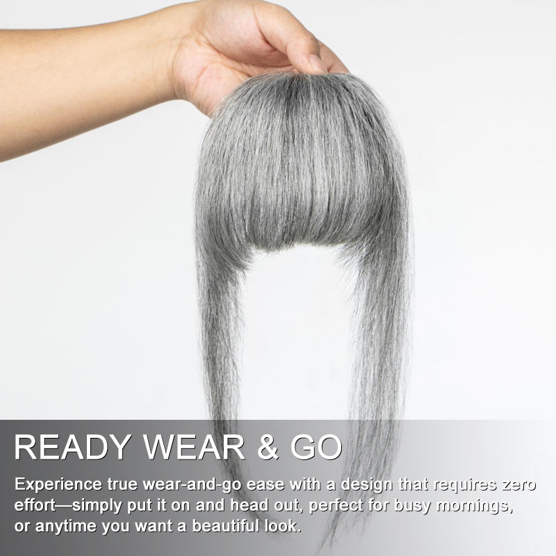 Soul Lady WIgs detailed view of the standard salt and pepper clip-in full bangs hairpiece, highlighting the blend of grey tones and face-framing side pieces.